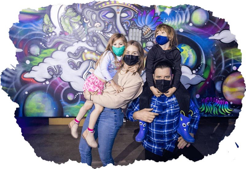 A family visiting the Artopia exhibit in Phoenix
